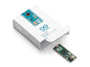 Arduino Micro without headers displayed alongside packaging contents, including product box.